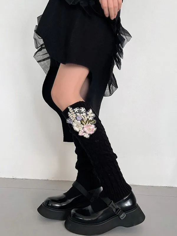 Calentador de piernas tejido trenzado con bordado floral