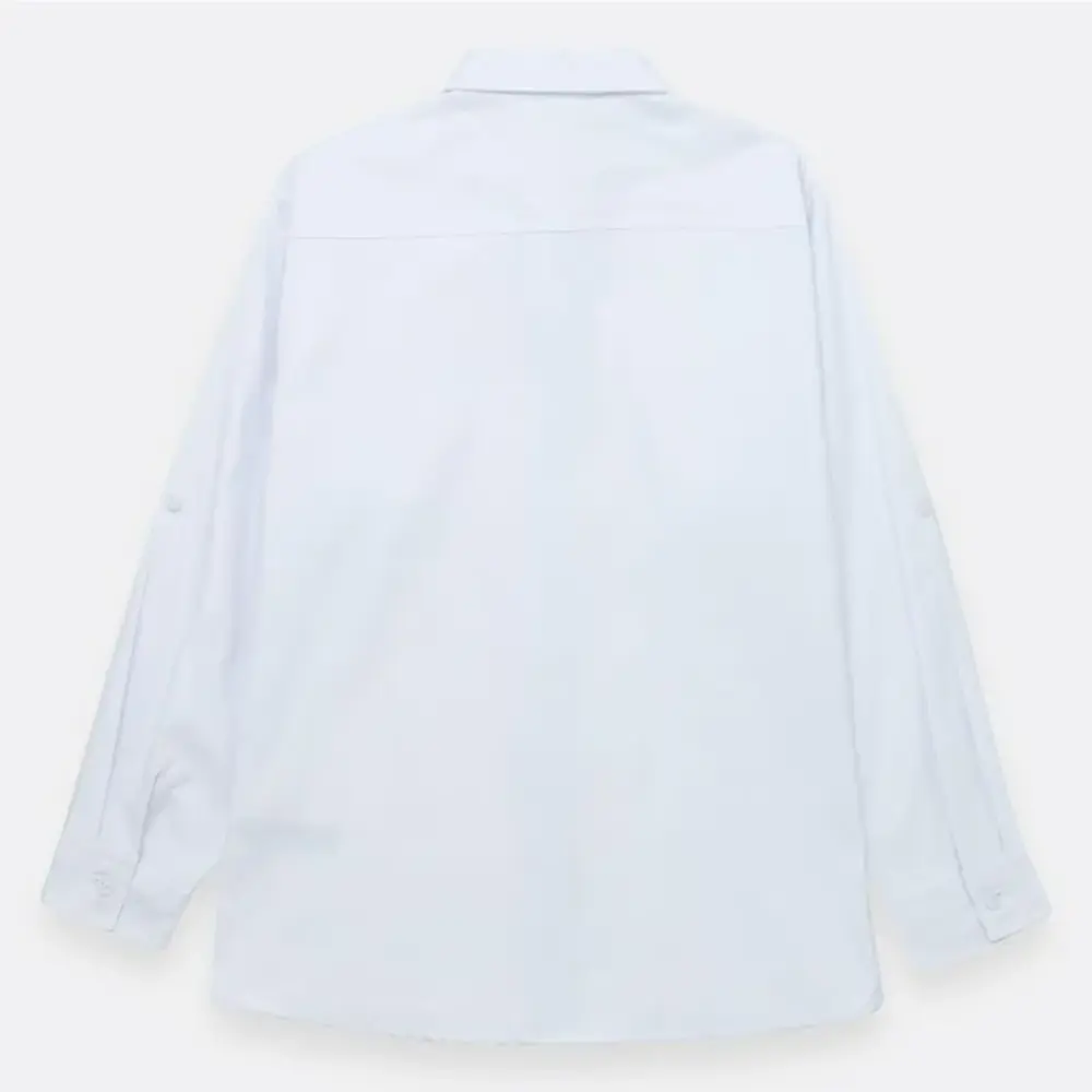 Camisa manga larga con bolsillo en tejido