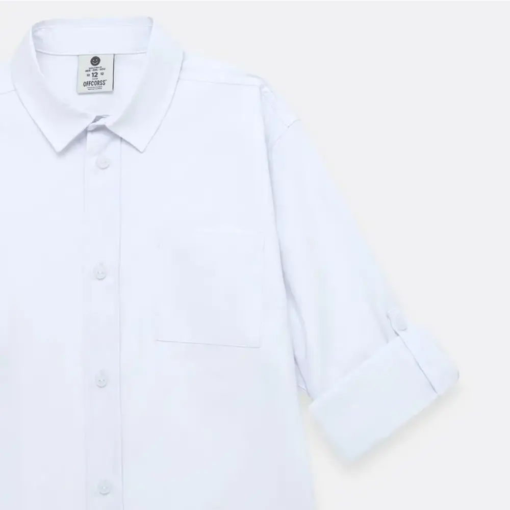Camisa manga larga con bolsillo en tejido
