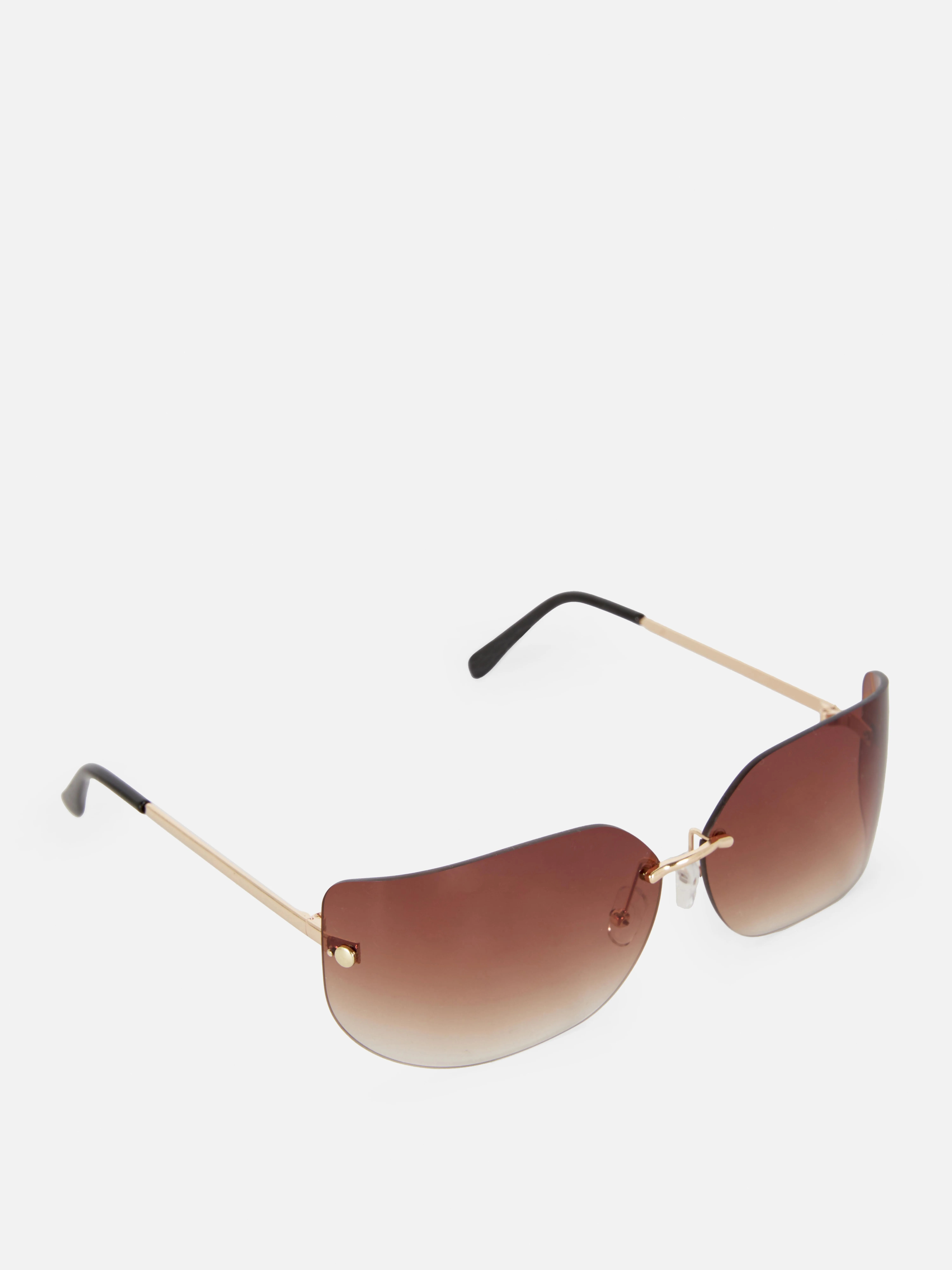 Gafas de sol de montura invisible curva de Rita Ora