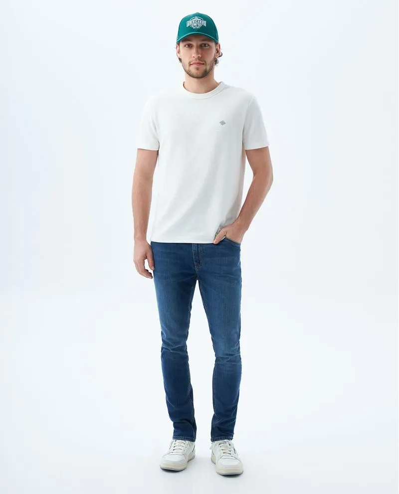 Jean Tapered fit tono medio para hombre