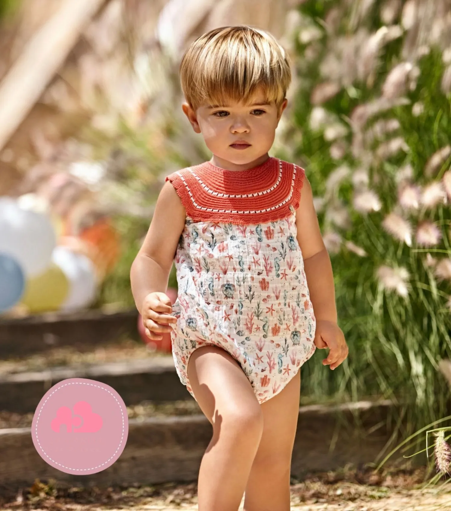 Pelele unisex cuerpo punto coral con tejido estampado